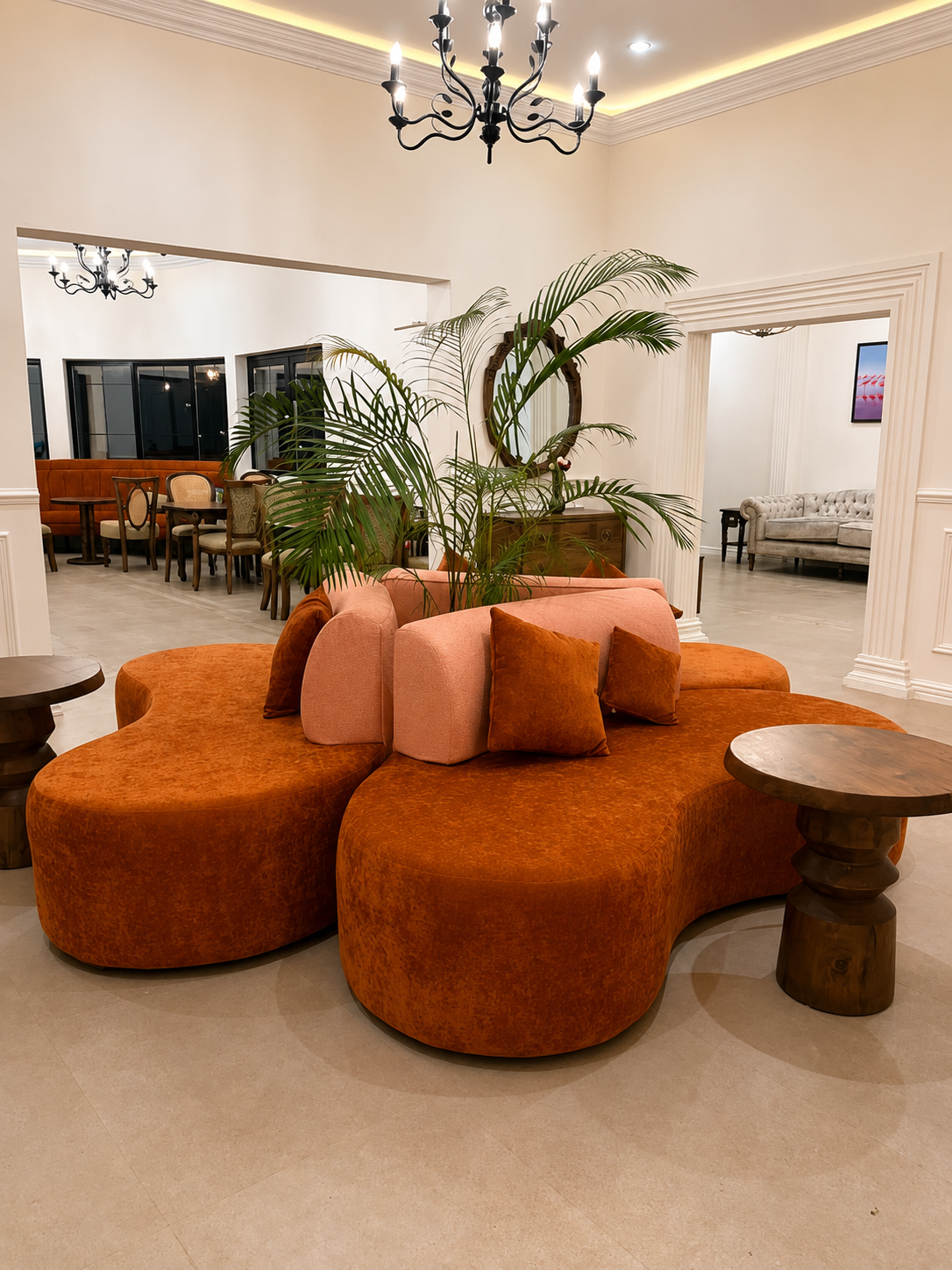 The lobby at Haile: the burnt-orange sofa the whole house is coloured around.