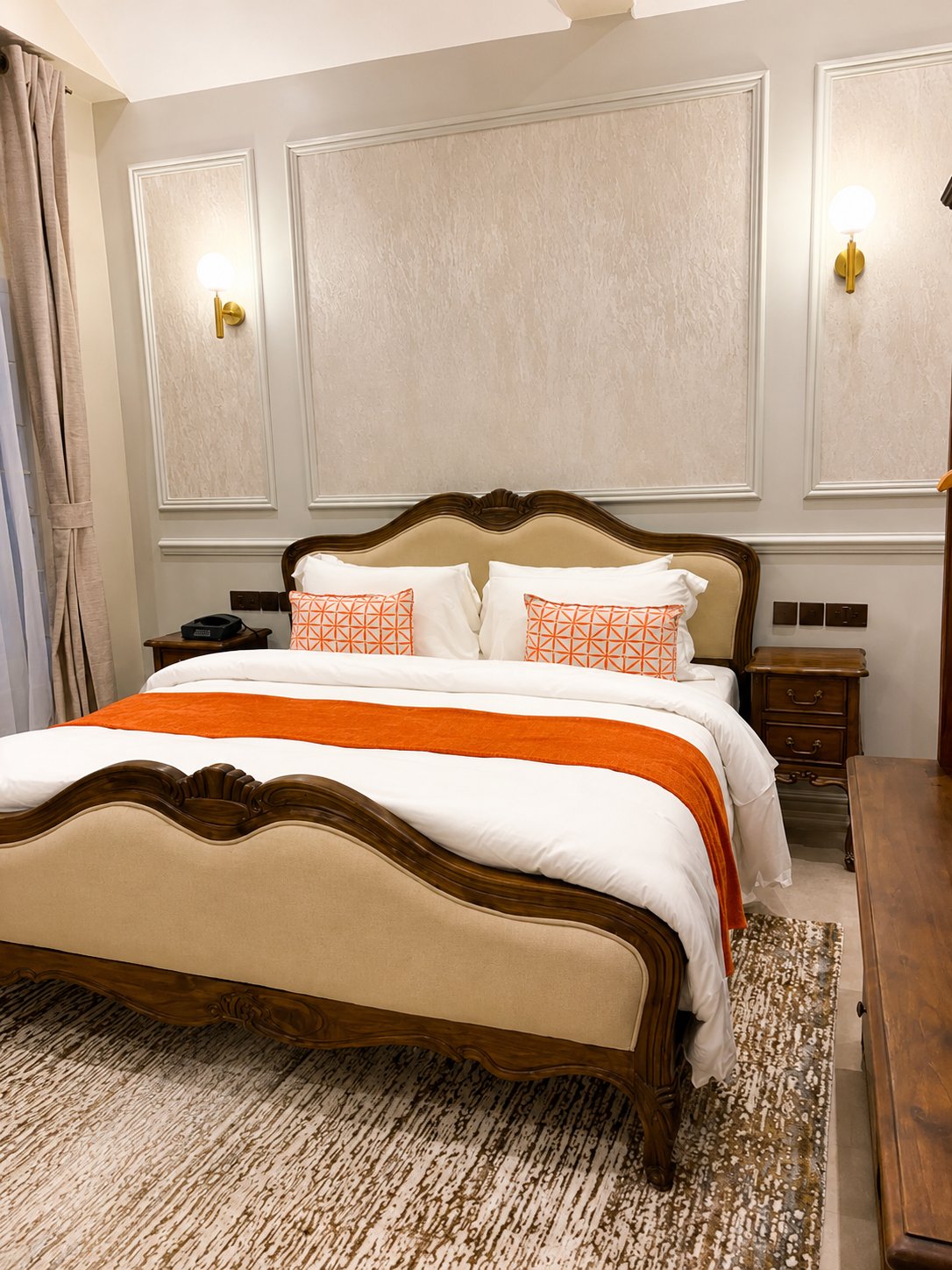 The Garden Room: a carved walnut bed opening onto a private garden terrace.